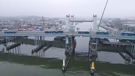 View-Of-New---Old-Bridges-Over-Gota-River-In-Gothenburg,-Sweden---ascending-drone-shot