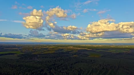 AERIAL-high-view-of-countryside-with-clouds-sunset,-Moscow-Region,-Russia