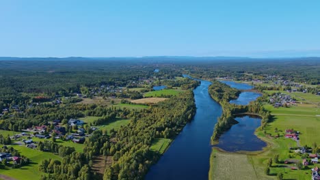 Picturesque-Landscape-Of-Green-Fields-In-Malung-Near-Vasterdal-River-On-A-Bright-Day-In-Dalarna,-Sweden