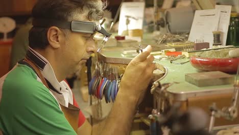 Italian-Goldsmith-at-work-building-an-engagement-or-a-wedding-ring