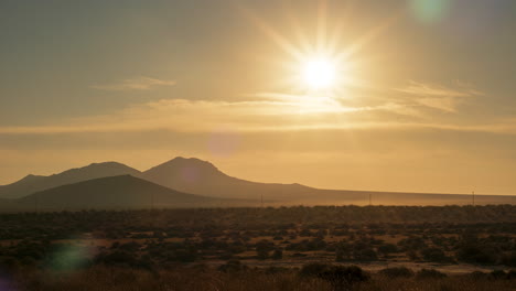 Gloriously-golden-sunrise-over-the-harsh-heat-of-the-Mojave-Desert---static-time-lapse