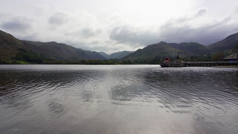 Panning-view-of-the-Ullswater-lake-steamer-ship-jetty-on-a-tranquil-day
