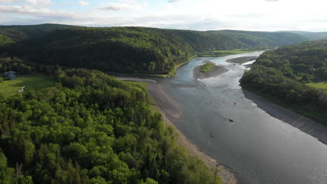 Fly-Over-Drone-Footage-of-fly-fishing-at-Retsigouche-River,-New-Brunswick,-Canada