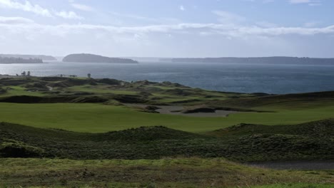 A-sunny-view-of-Chambers-Bay-Golf-Course,-Ketron-Island,-Anderson-Island,-and-Puget-Sound