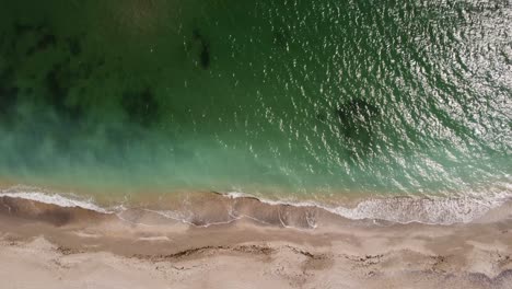 Aerial-View-Of-Turquoise-Water-And-Sandy-Beach