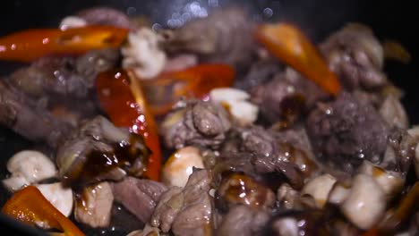 Close-up-video-stir-fry-cooking-pheasant-Chinese-style