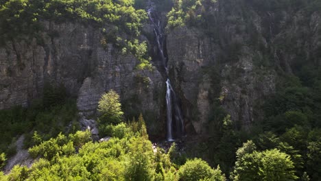 Panoramic-view-of-waterfall-on-rocky-slope-of-mountain-in-Theth,-Albania