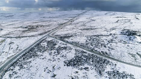 North-York-Moors-Snow-Scene-Drone-Flight,-Castleton,-Westerdale,-Rosedale,-Flight-over-Moorland-and-roads-towards-Danby-Beacon,-Winter-cold-and-moody-clouds,-Phantom-4,-Clip-12