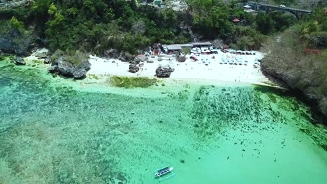 Drone-flying-side-to-side-of-Padang-Padang-Beach-in-Bali,-Indonesia
