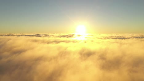 Drone-aerial-view-of-moving-clouds-and-sun-over-horizon
