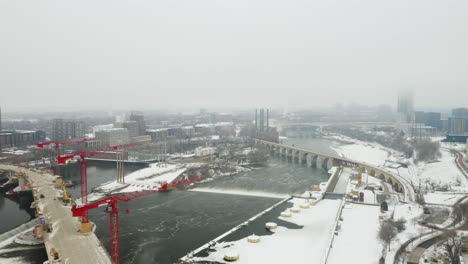 Aerial-View-of-Mississippi-River-in-Minneapolis,-Minnesota-on-Foggy-Winter-Morning