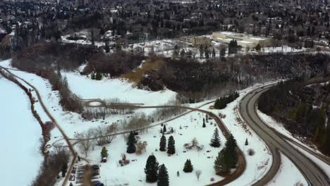 winter-aerial-semi-birds-eye-view-fly-over-Victoria-Park-headed-towards-Governement-House-Park-by-Groat-Rd-NW-river-valley-road-next-to-the-monument-Ksan-Totem-Pole-and-the-Korean-Pavillion-museum-1-2