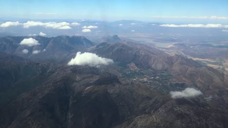 Aerial-Drone-shot-of-mountain-ranges-from-a-plane