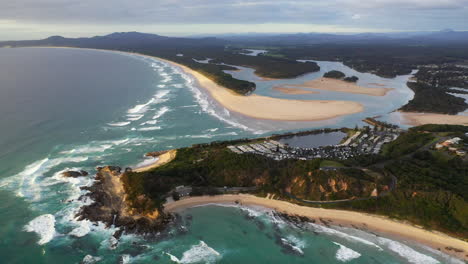 Cinematic-wide-drone-shot-of-Wellington-Rocks,-Foster-beach,-the-Nambucca-River-and-ocean-at-Nambucca-Heads-New-South-Wales-Australia