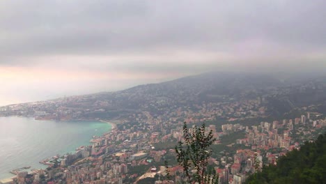 Beautiful-shot-of-Lebanon-Landscape,-city-of-Harisa-with-buildings,-sea,-trees---mountains