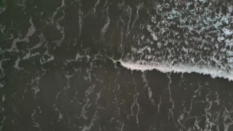 Aerial-top-shot-of-waves-in-slow-motion