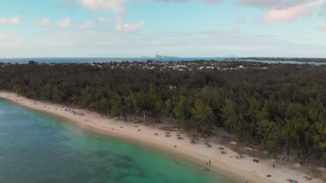 Drone-shot-of-blue-ocean-and-beach-in-the-summer