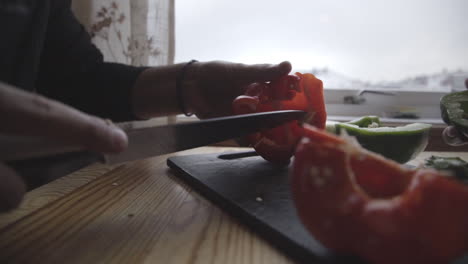 Deseeding-bell-pepper-at-Norwegian-kitchen-making-a-meal