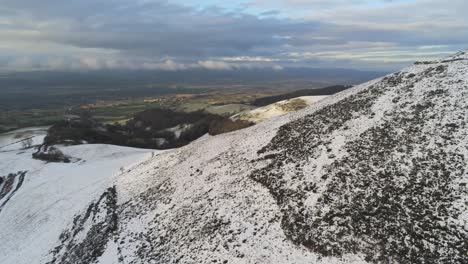 Snowy-winter-countryside-mountain-valley-panoramic-Welsh-hiking-national-park-aerial-valley-reveal-left-view