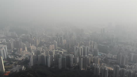 Aerial-drone-shot-of-Chuk-Un-and-San-Po-Kong-from-Lion-Rock-in-Hong-Kong-on-a-foggy-day-in-October