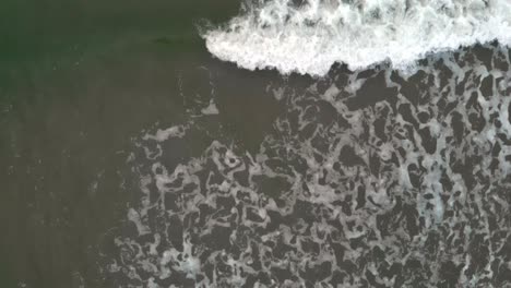 Aerial-top-shot-of-waves-in-slow-motion-