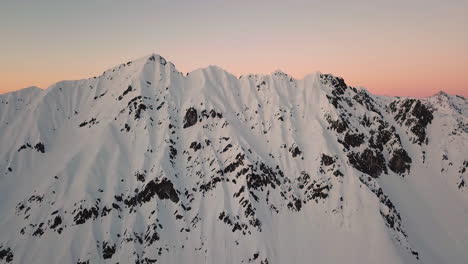 Epic-Aerial-Flight-towards-Mountain-sunset-evening-Peaks-Inspirational-Motivational-Nature-Background-UHD-4K