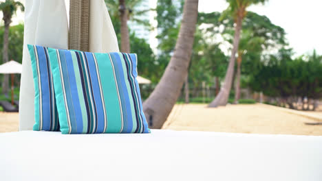 comfortable-pillow-on-pavilion-near-beach---travel-and-vacation-concept