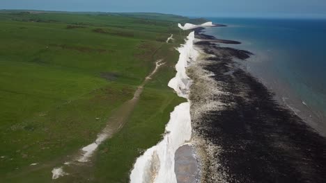 Aerial:-Seven-Sisters-white-chalk-cliffs,-Beachy-Head-England
