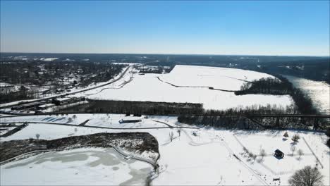 Aerial-footage-of-a-frozen-fishing-pond-in-Clarksville,-Tennessee