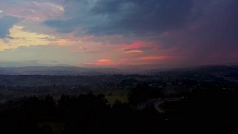 Sunset-On-A-Dark-Cloudy-Sky-Before-Storm-In-The-Countryside---Drone-Shot