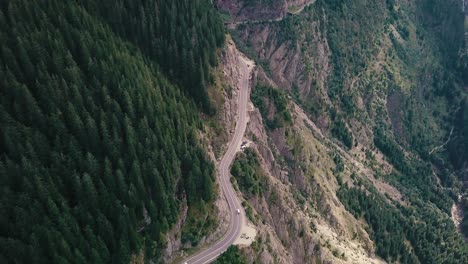 High-angle-shot-of-a-mountain-road-next-to-a-cliff