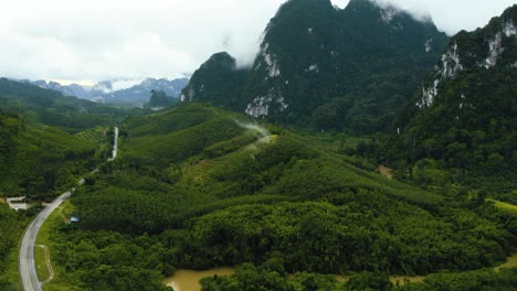 Drone-shot-of-tropical-mountain-landscape-with-clouds
