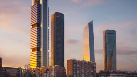 Timelapse-of-Cuatro-Torres-bussines-area-at-sunset