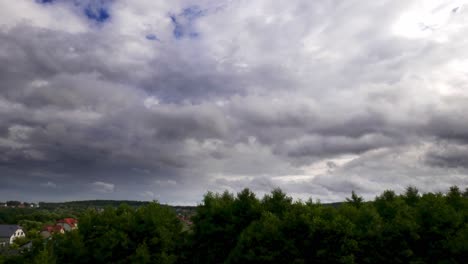 Timelapse-of-rain-clouds-moving-on-a-blue-sky