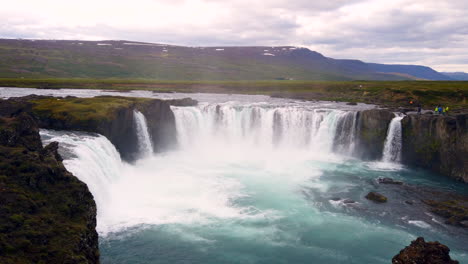 Beautiful-12-meter-39-feet-high-Godafoss-Waterfall-in-the-river-Skjálfandafljót-in-north-Iceland,-wide-static-from-above-4k-ProRezHQ