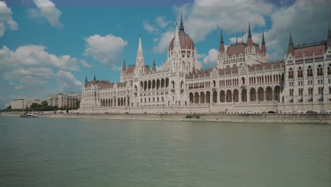Boat-ride-through-Danube,-Passing-by-very-close-to-Budapest-Parliament,-sunny
