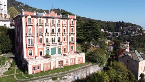 Luxury-vintage-hotel-building-in-Brunate,-Italy,-aerial-drone-view
