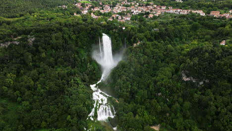 Man-made-Waterfall-Marmore-Falls-With-Mist,-Surrounded-By-Lush-Green-Forest-In-Umbria,-Italy
