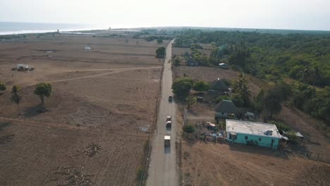 Drone-aerial-of-cars-driving-on-the-highway-on-their-way-to-the-beach-in-Guatemala