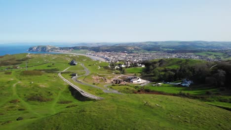 Drone-flight-over-Great-Orme-with-scenic-views-of-the-Welsh-coast,-Llandudno