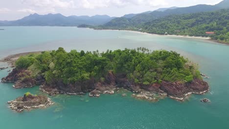 Aerial-view-over-idyllic-Koh-Chang-isolated-exotic-paradise-island-heading-towards-turquoise-ocean-coastline