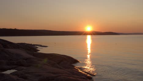 Sunset-by-water-in-Sundsvall,-Sweden