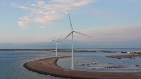 Windturbines-and-aquaculture-during-sunset-on-the-island-Neeltje-Jans,-the-Netherlands