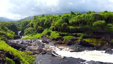 Pan-from-Seven-Sacred-Pools-at-'Ohe'o-Gluch-waterfalls-in-Haleakala-national-Park-to-blue-Pacific-Ocean-on-Road-to-Hana,-Maui,-Hawaii-4k-ProRezHQ