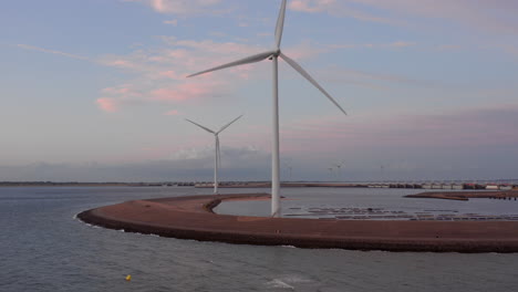 Windturbines-during-sunset-on-the-island-Neeltje-Jans,-the-Netherlands