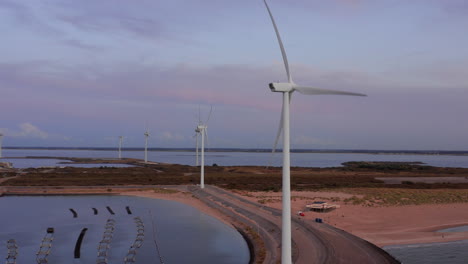 Windturbines-and-aquaculture-during-sunset-on-the-island-Neeltje-Jans,-the-Netherlands