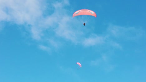 A-slow-motion-shot-of-paragliders-in-the-sky