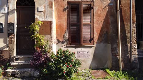 Facade-of-an-old-building-in-Borghetto-di-Ostia,-a-district-of-Rome-in-Italy-that-kept-its-atmosphere-of-a-medieval-village