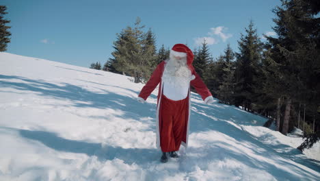 Santa-walks-to-the-camera-through-a-snowy-field