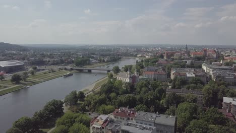 Poland,-Krakow,-Krakau-drone-shot-following-Wisla-to-the-main-castle-Wawel